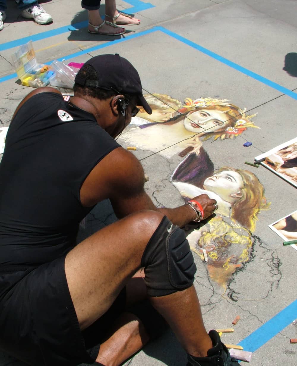Man creating sidewalk chalk art