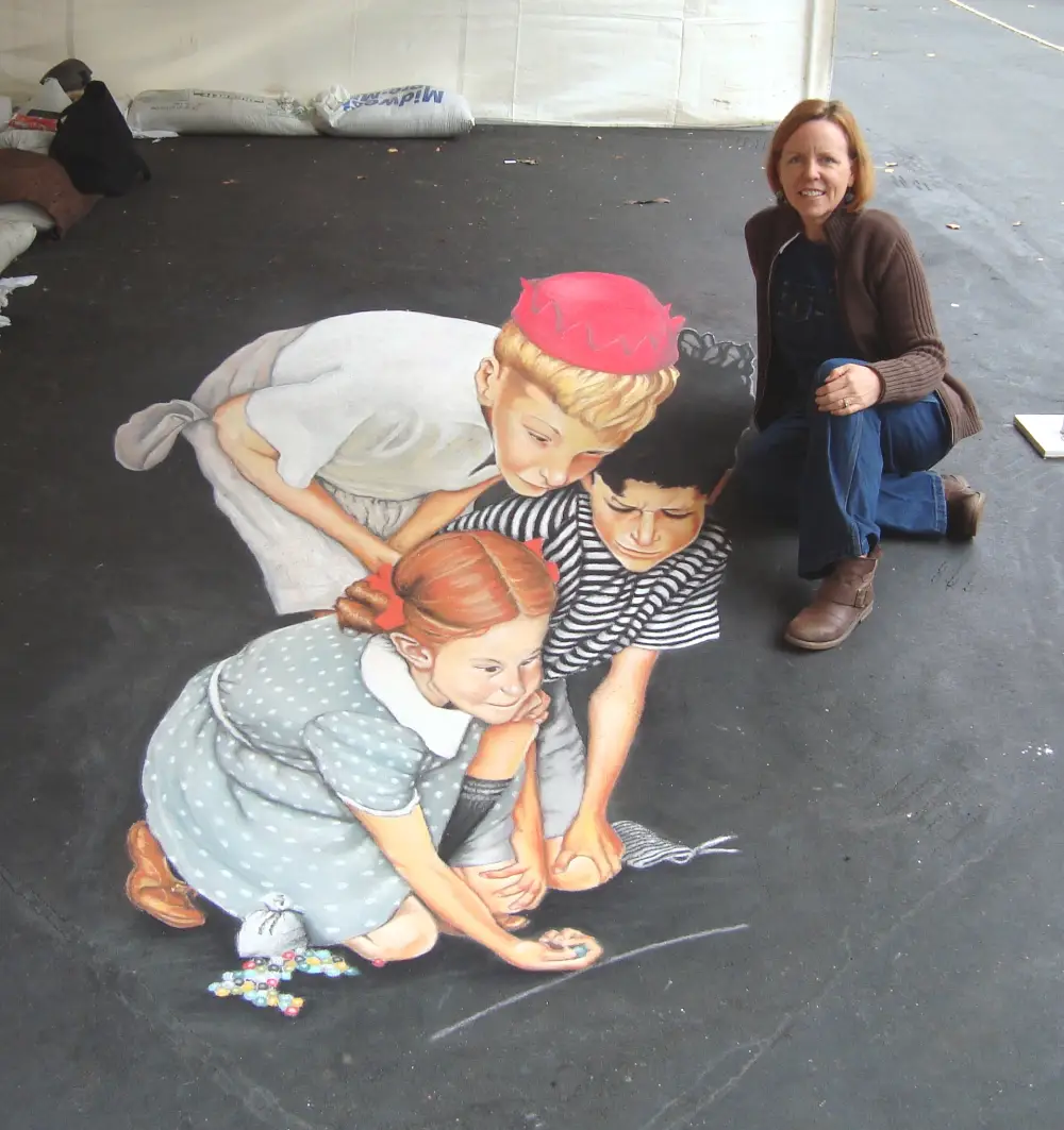 Man creating sidewalk chalk art