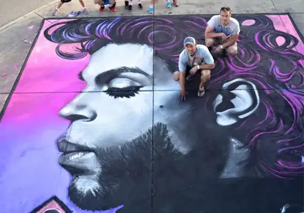 Man creating sidewalk chalk art